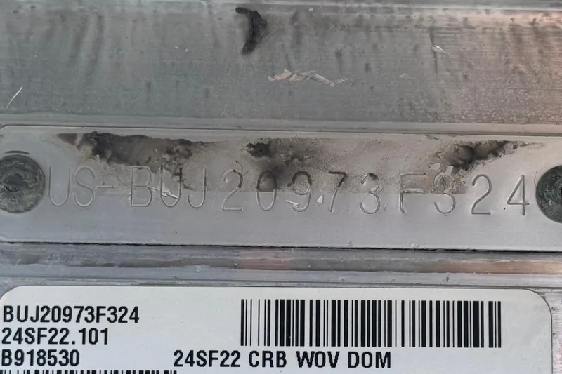 Slide: The Image of 2024 Sun Tracker SportFish 22 DLX hull identification number and barcode details. - 35