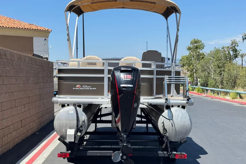 Slide: The Image of 2024 Sun Tracker SportFish 22 DLX pontoon boat with Mercury 115 Pro XS engine. - 5