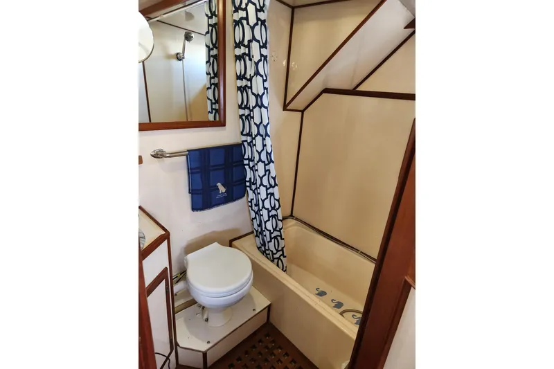Slide: The Image of Bathroom interior of 1987 Jefferson 42 SE Sundeck Motor Yacht with shower and toilet. - 25