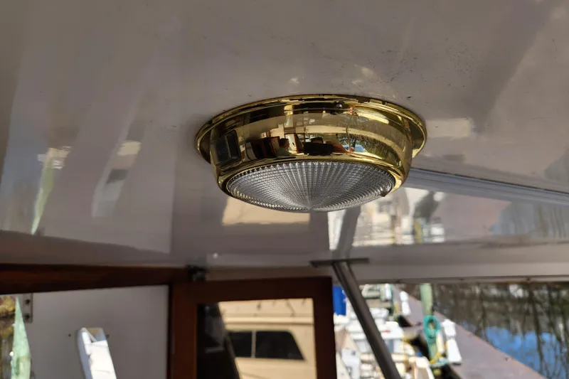 Slide: The Image of Brass ceiling light fixture on 1987 Jefferson 42 SE Sundeck Motor Yacht. - 27