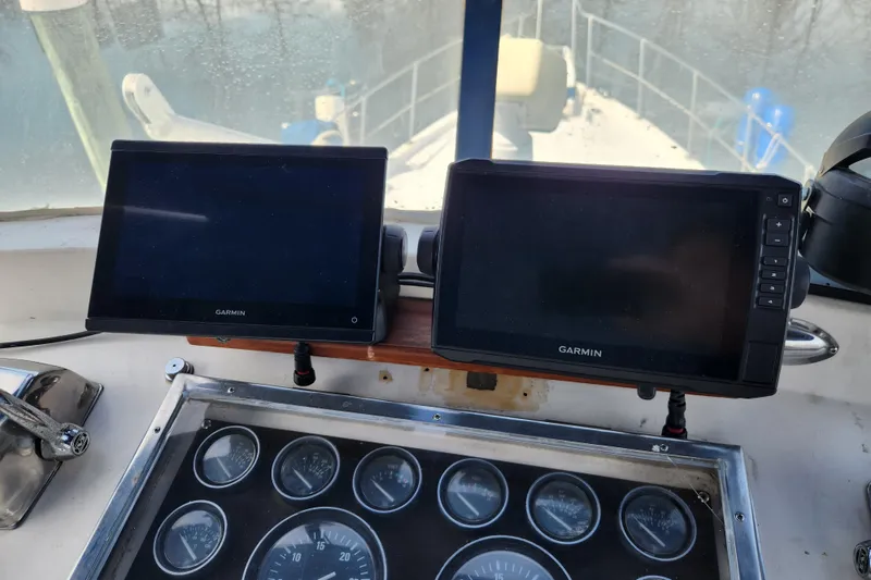 Slide: The Image of Helm of 1987 Jefferson 42 SE Sundeck Motor Yacht with Garmin displays and gauges. - 6