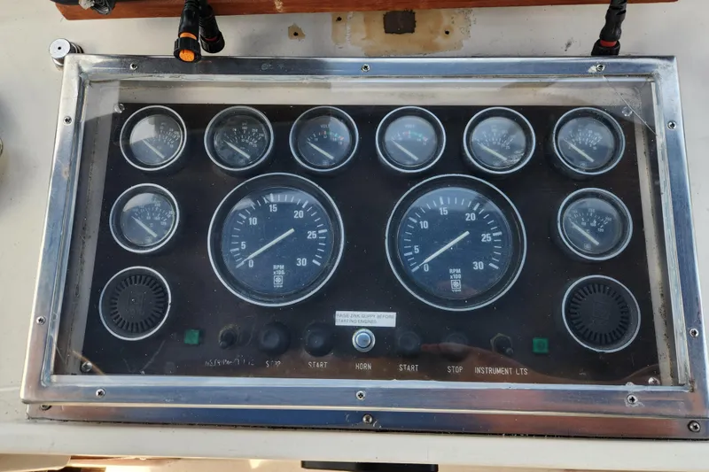 Slide: The Image of Instrument panel of a 1987 Jefferson 42 SE Sundeck Motor Yacht, featuring various gauges and controls. - 7