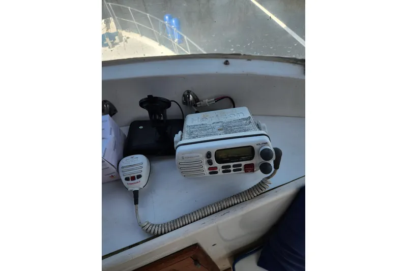 Slide: The Image of VHF radio equipment on 1987 Jefferson 42 SE Sundeck Motor Yacht dashboard. - 9