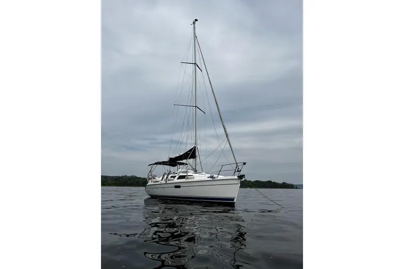 Slide: The Image of Sailboat on calm water, 2001 Marlow-Hunter 320, under cloudy sky. - 10
