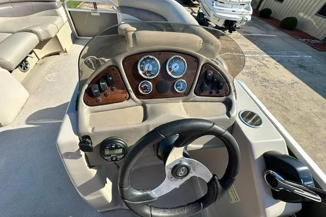 Slide: The Image of Steering console of a 2014 Veranda Relax V2275RC boat with gauges and controls. - 13