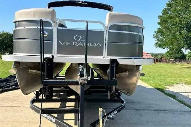 Slide: The Image of 2014 Veranda Relax V2275RC pontoon boat on trailer, parked outdoors. - 4