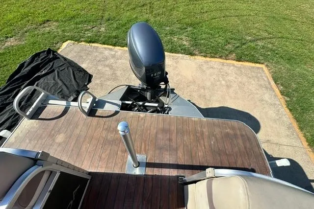 Slide: The Image of 2014 Veranda Relax V2275RC boat with outboard motor on wooden deck. - 7