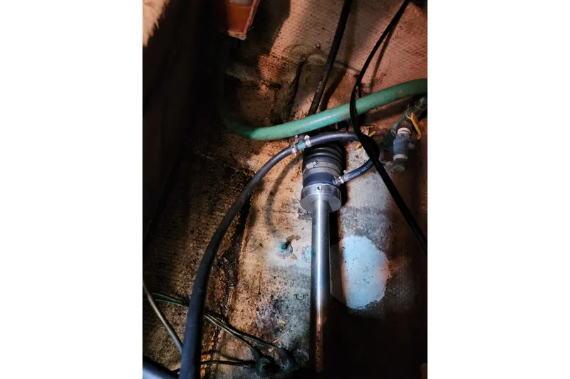 Slide: The Image of Engine compartment of 1987 Luhrs 40 Convertible boat showing hoses and fittings. - 14