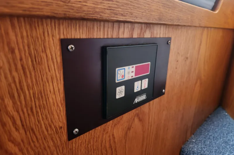 Slide: The Image of Control panel on 1987 Luhrs 40 Convertible boat, mounted on wooden interior. - 22