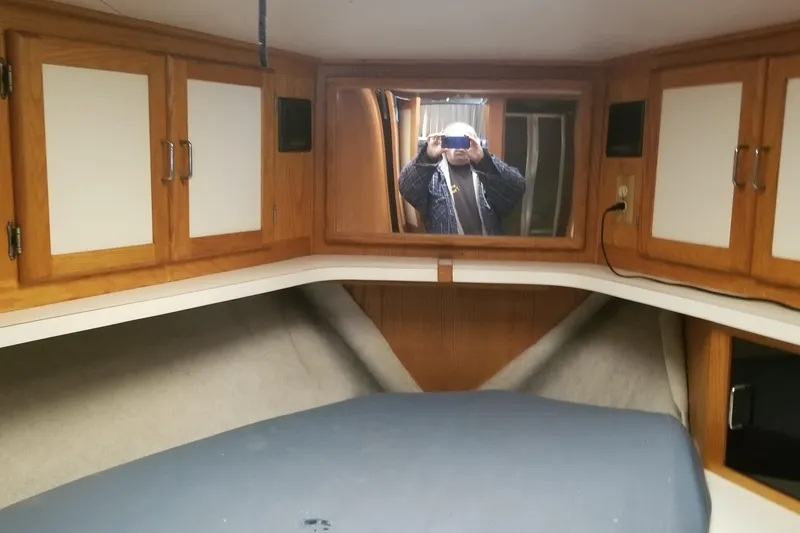 Slide: The Image of Interior of 1987 Luhrs 40 Convertible boat with wooden cabinets and mirror. - 33