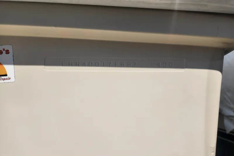 Slide: The Image of 1987 Luhrs 40 Convertible boat hull identification number (HIN) displayed on the surface. - 43