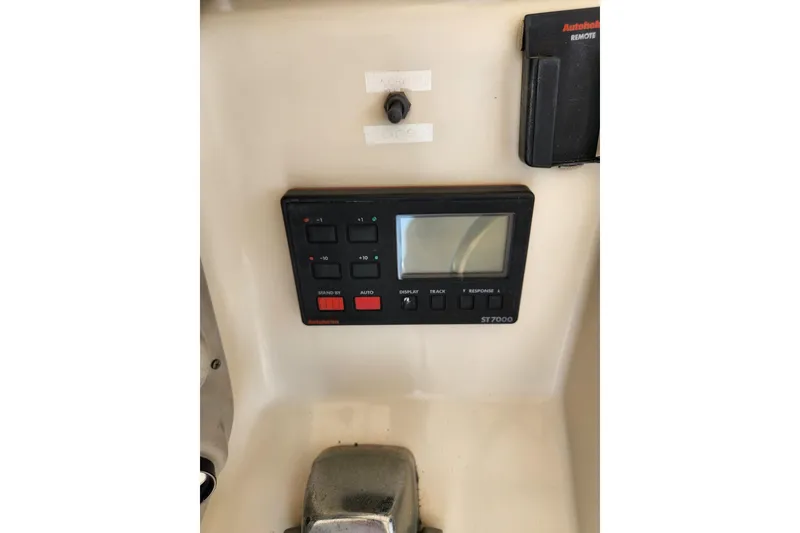 Slide: The Image of Control panel of a 1987 Luhrs 40 Convertible boat featuring an Autohelm ST7000 system. - 49