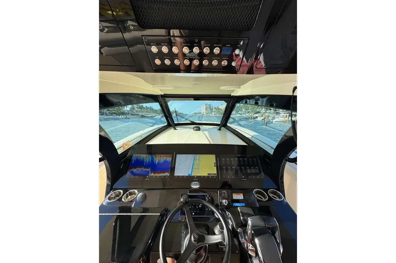 Slide: The Image of 2025 Scout 425 LXF boat dashboard with advanced navigation and control systems. - 18