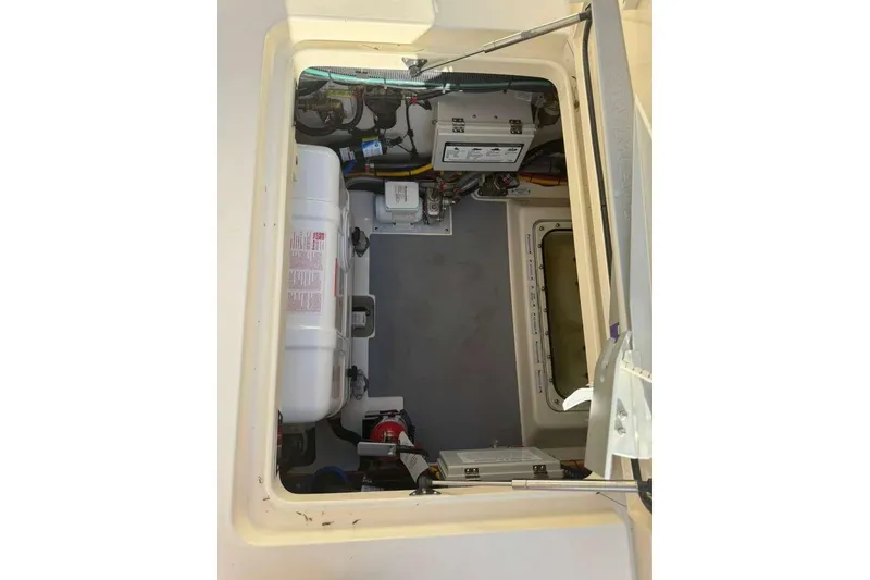 Slide: The Image of Engine compartment of 2025 Scout 425 LXF boat, showcasing equipment and wiring. - 21