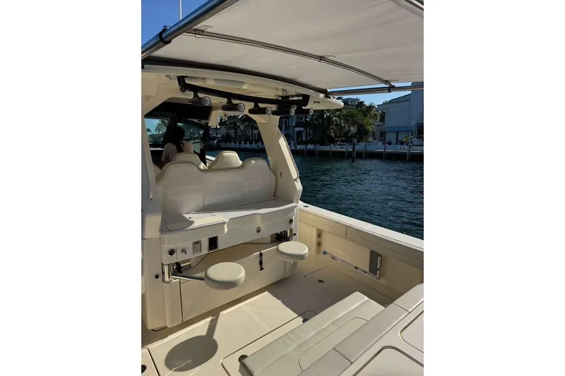 Slide: The Image of 2025 Scout 425 LXF boat interior with seating and water view. - 26