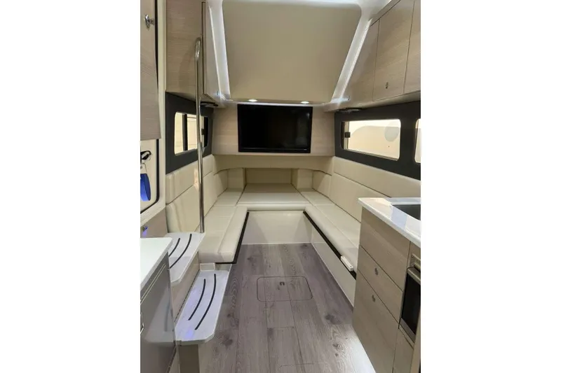 Slide: The Image of Luxurious interior of 2025 Scout 425 LXF boat with modern seating and entertainment system. - 42