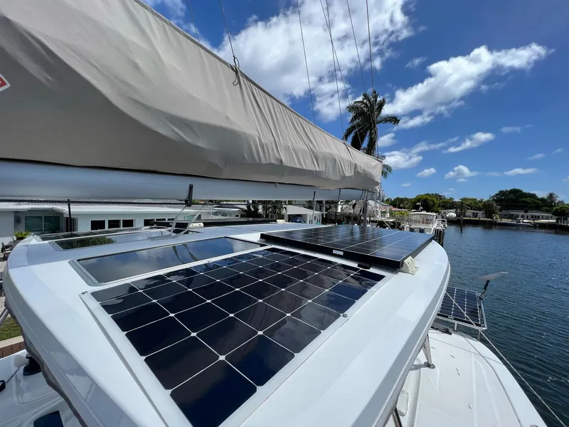 Slide: The Image of 2022 Lagoon 46 catamaran with solar panels on the roof. - 10