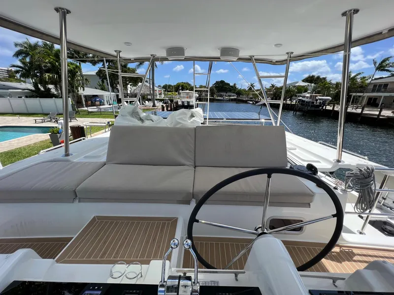 Slide: The Image of Interior view of 2022 Lagoon 46 yacht with helm and seating area. - 11