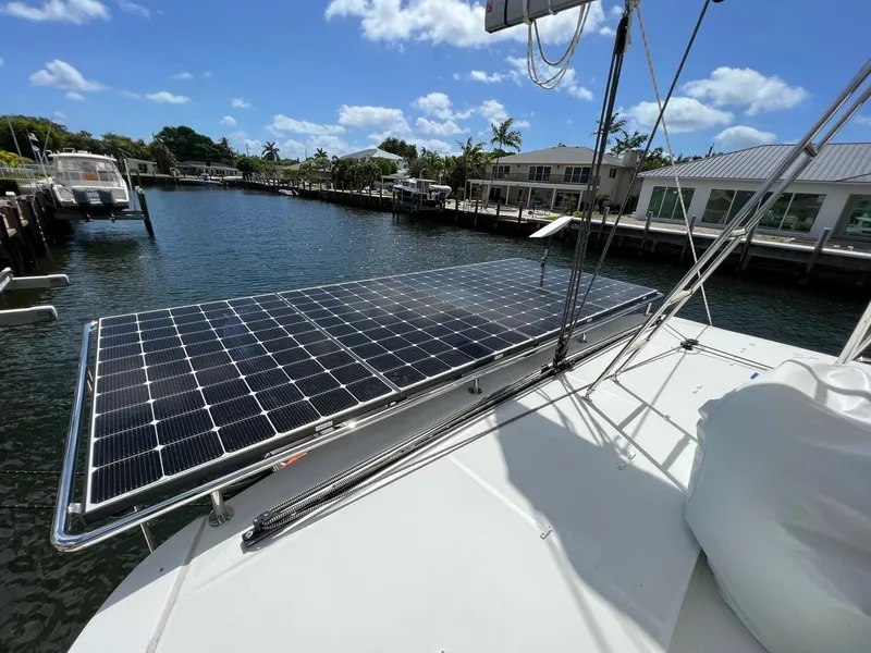 Slide: The Image of Solar panel on Lagoon 46 catamaran, 2022, in sunny harbor. - 12