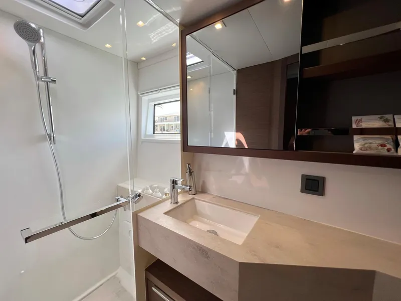 Slide: The Image of Modern bathroom on Lagoon 46 catamaran, year 2022. - 28