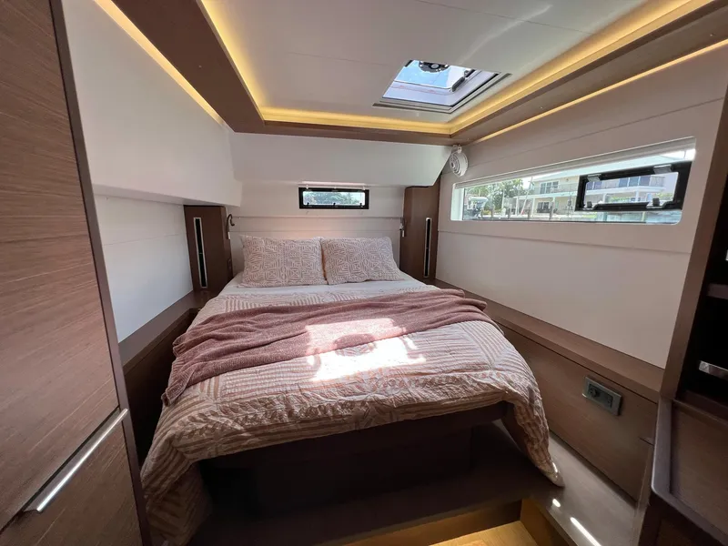 Slide: The Image of Interior of Lagoon 46 yacht, bedroom with double bed, 2022 model. - 30