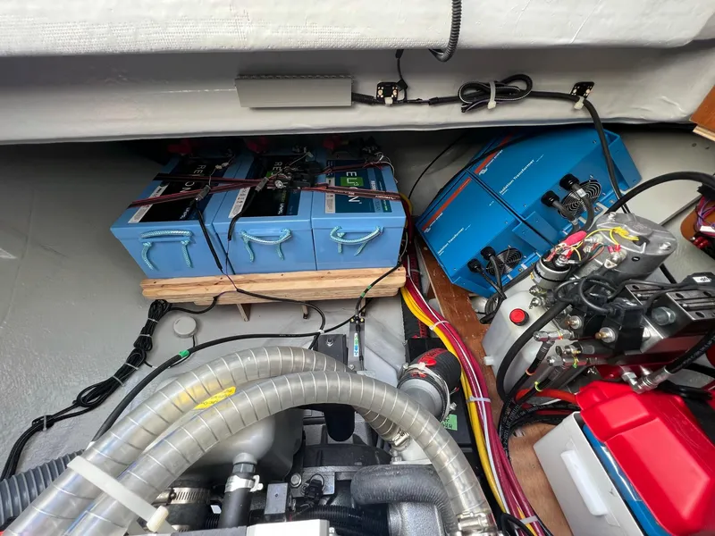 Slide: The Image of Lagoon 46 2022 engine room with batteries and wiring. - 33