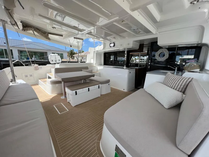 Slide: The Image of Interior of a 2022 Lagoon 46 yacht with elegant seating area. - 4