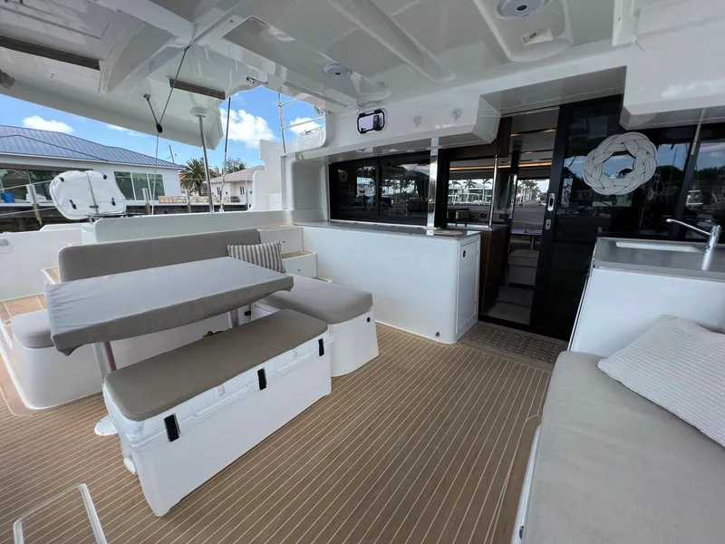 Slide: The Image of Interior of a 2022 Lagoon 46 yacht with seating area. - 6