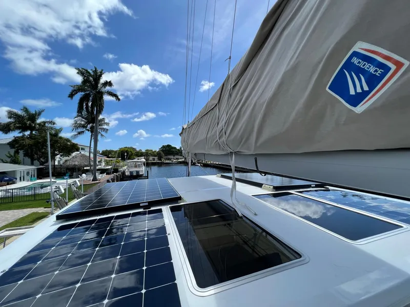 Slide: The Image of 2022 Lagoon 46 catamaran with solar panels and sail. - 9