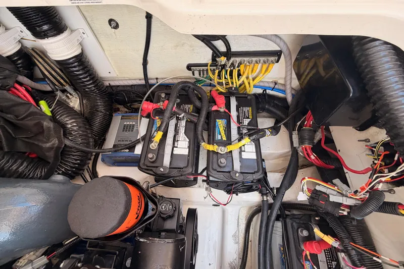 Slide: The Image of 2022 Aviara AV32 I/O engine compartment with batteries and wiring. - 45