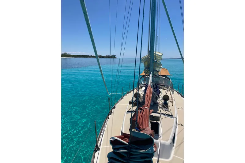 Slide: The Image of Sailing on a 1988 Cape Dory 36 yacht in clear turquoise waters. - 2