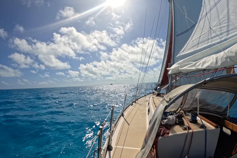 Slide: The Image of Sailing on a 1988 Cape Dory 36 under sunny skies and blue ocean waters. - 25