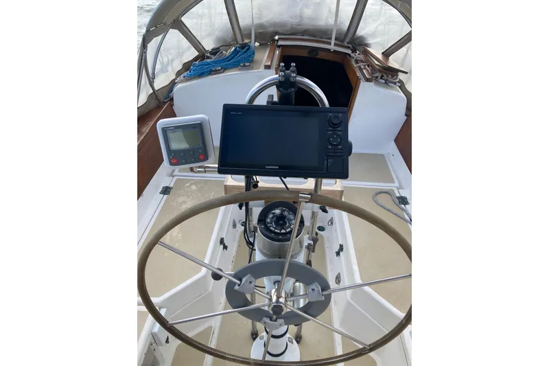 Slide: The Image of Cockpit of 1988 Cape Dory 36 sailboat with navigation equipment and steering wheel. - 6