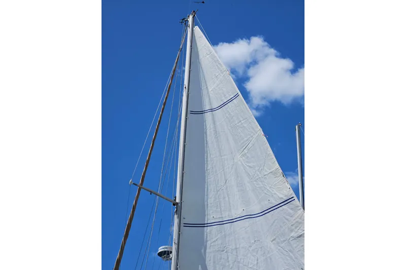 Slide: The Image of Sail of 1988 Cape Dory 38 against a clear blue sky. - 9