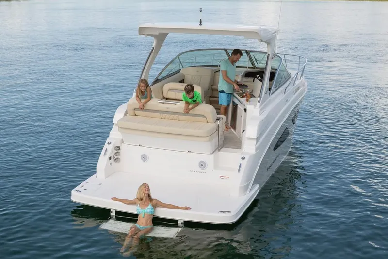 Slide: The Image of Manufacturer Provided Image: 2026 Regal 33 Express boat with people enjoying leisure time on the water. - 3