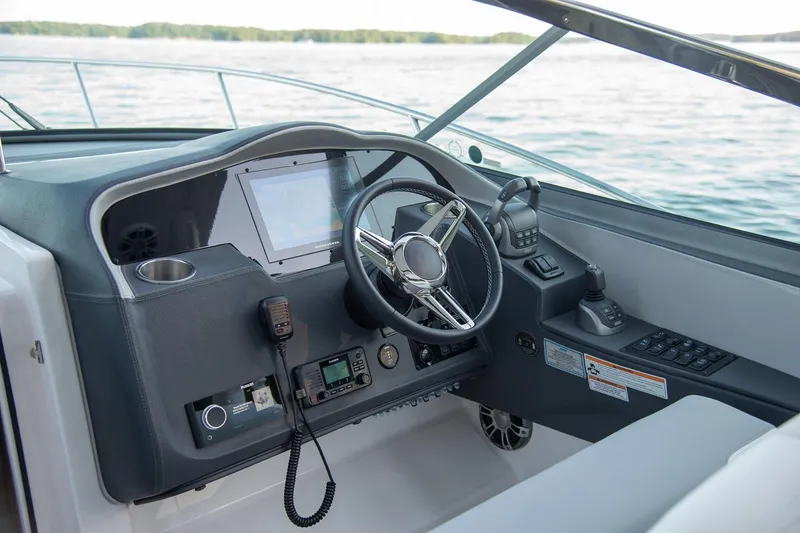 Slide: The Image of Manufacturer Provided Image: 2026 Regal 33 Express boat helm with modern controls and navigation system. - 4