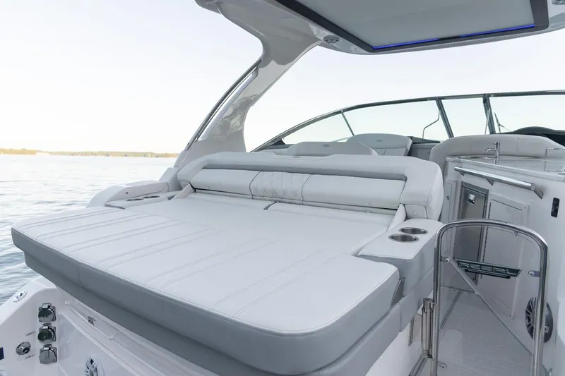 Slide: The Image of Manufacturer Provided Image: 2026 Regal 33 Express boat interior with luxurious seating and modern amenities on calm water. - 7