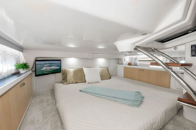 Slide: The Image of Manufacturer Provided Image: Luxurious interior of 2026 Regal 33 Express yacht with cozy bed and modern decor. - 9
