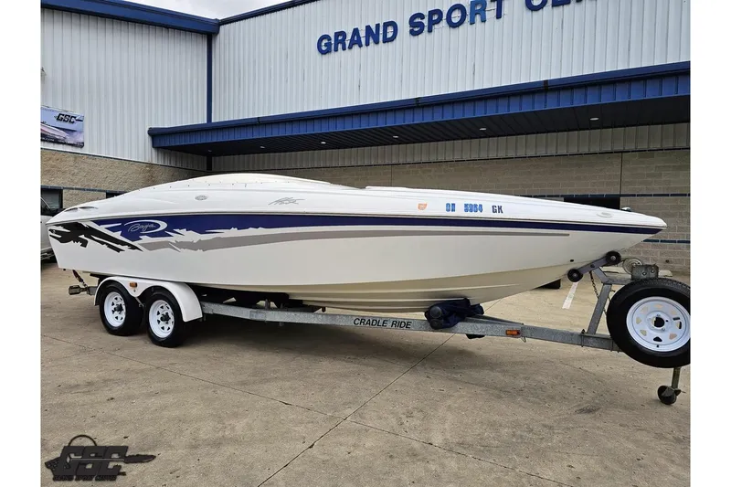 Slide: The Image of 2004 Baja H2X boat on trailer outside Grand Sport Center. - 12
