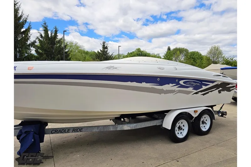 Slide: The Image of 2004 Baja H2X speedboat on trailer, featuring sleek design and vibrant graphics. - 19