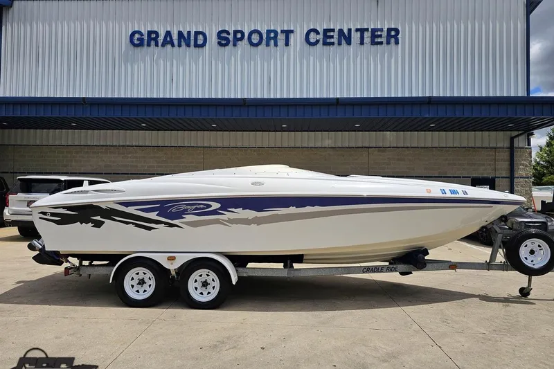 Slide: The Image of 2004 Baja H2X boat on trailer at Grand Sport Center dealership. - 2