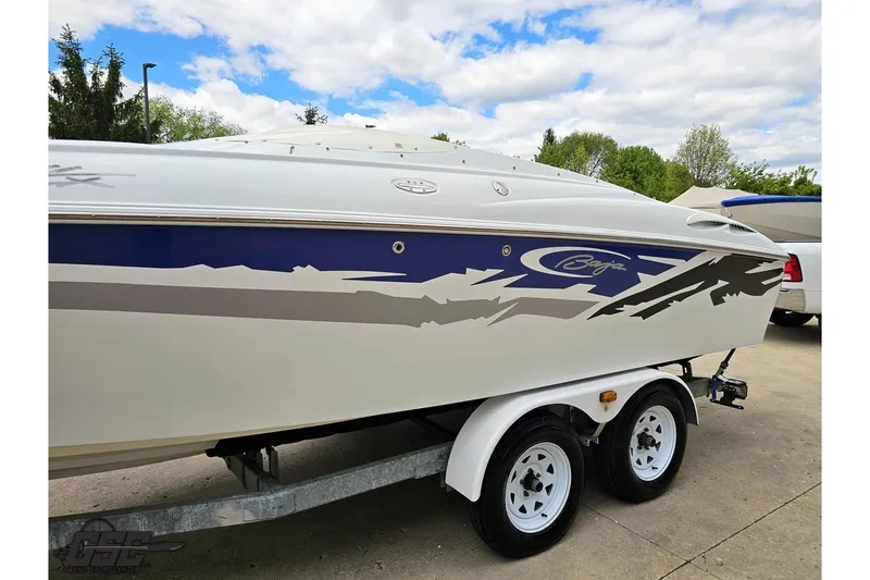 Slide: The Image of 2004 Baja H2X speedboat on trailer, featuring sleek design and vibrant graphics. - 20