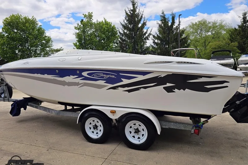 Slide: The Image of 2004 Baja H2X speedboat on trailer, featuring sleek design and vibrant graphics. - 27