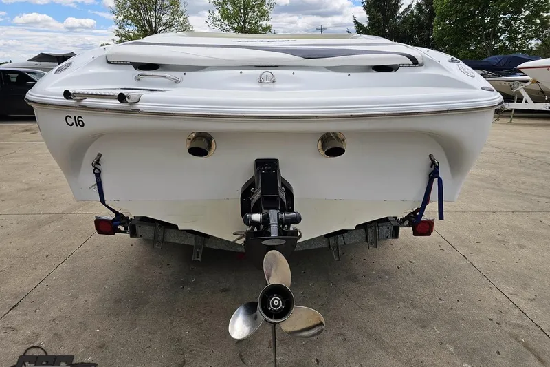 Slide: The Image of Rear view of a 2004 Baja H2X boat on a trailer, showcasing propeller and exhaust. - 30