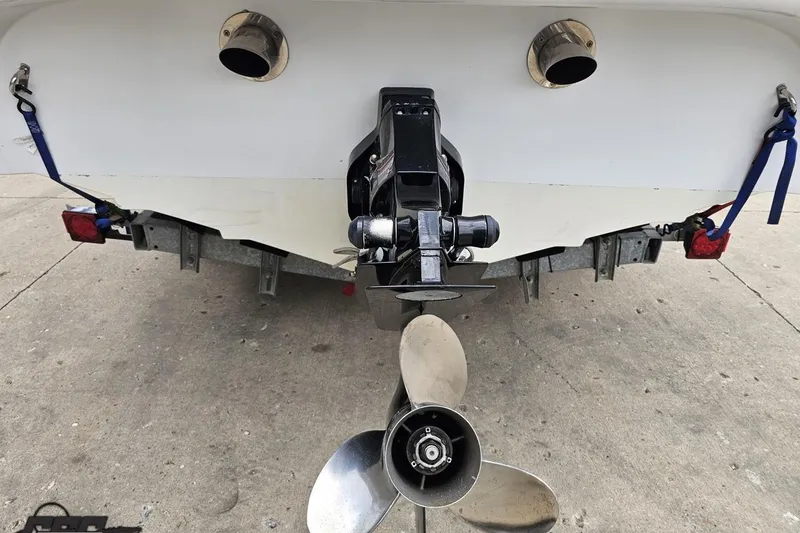 Slide: The Image of Rear view of a 2004 Baja H2X boat with propeller and exhaust ports. - 38