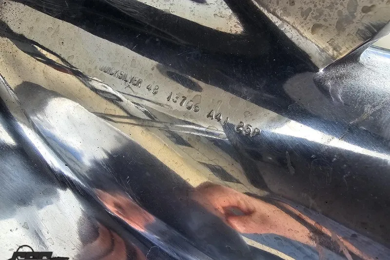 Slide: The Image of Close-up of a 2004 Baja H2X boat propeller with engraved specifications. - 39