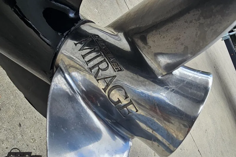 Slide: The Image of Close-up of a polished stainless steel Mirage propeller on a 2004 Baja H2X boat. - 40