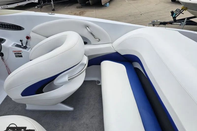 Slide: The Image of 2004 Baja H2X boat interior with white and blue seating, showcasing sleek design. - 50