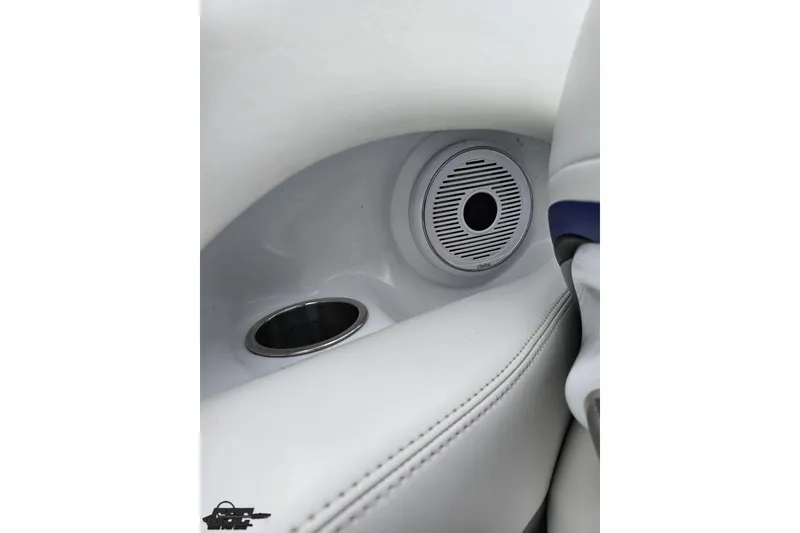 Slide: The Image of Interior of 2004 Baja H2X boat featuring speaker and cup holder. - 52