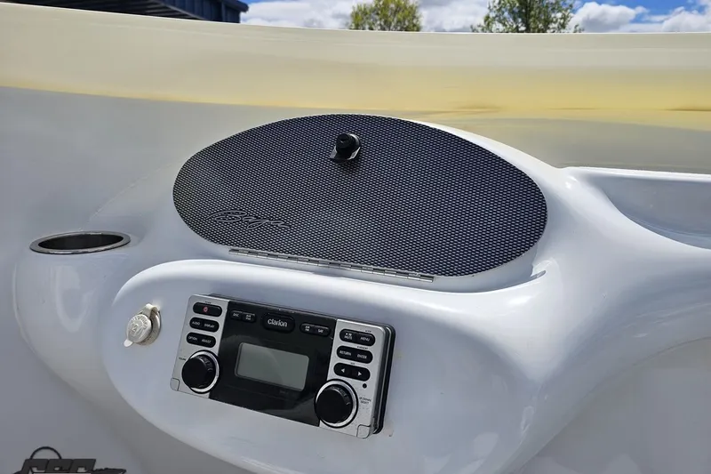 Slide: The Image of 2004 Baja H2X boat dashboard with Clarion stereo system and speaker. - 55
